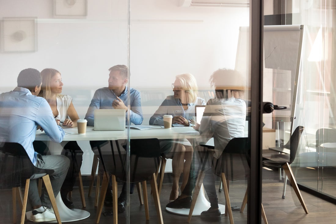 a group of people sitting at a table